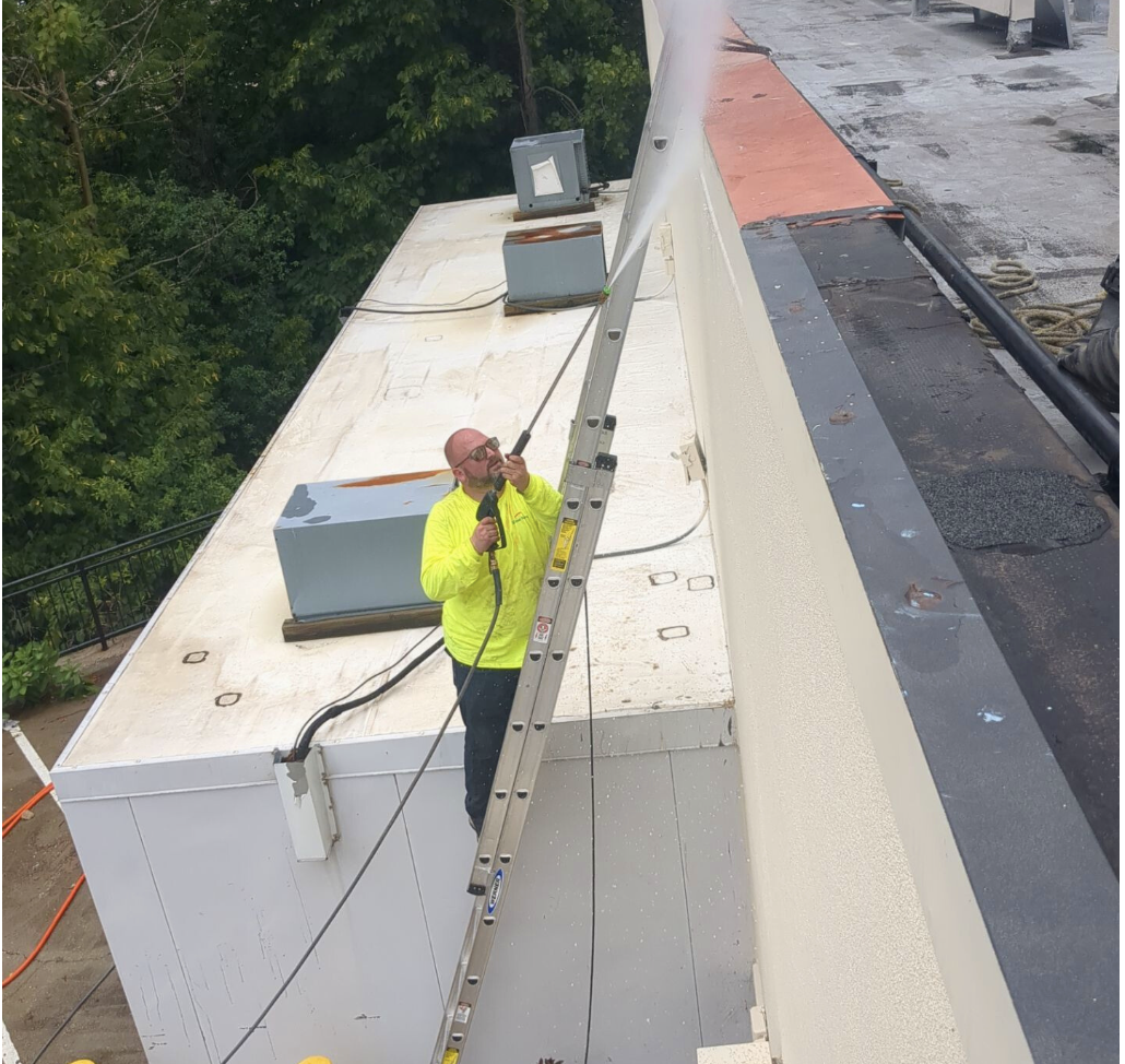 Worn parapet flashing and membrane edge during commercial roof inspection checklist review