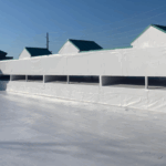 Commercial roof ventilation system with HVAC unit on reflective membrane providing efficient airflow
