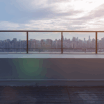 Commercial rooftop overlooking city skyline, illustrating roof color and energy impact in urban settings.