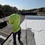 Silicoat Roofing technician performing roof maintenance during a commercial roof asset inspection