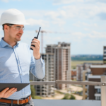 Facility manager checking commercial roof problems during a routine rooftop inspection