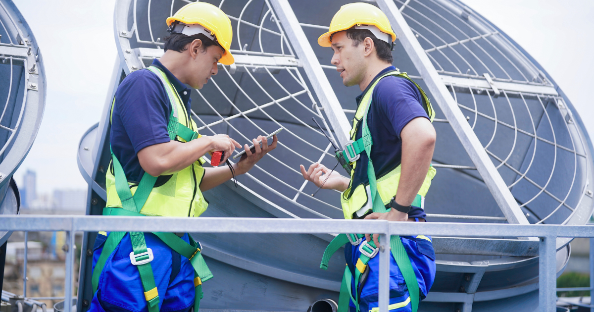 Commercial roof penetrations near HVAC units with worn flashing and leak risk