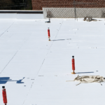 roof coating vs replacement on a commercial flat roof - Silicoat Roofing Michigan