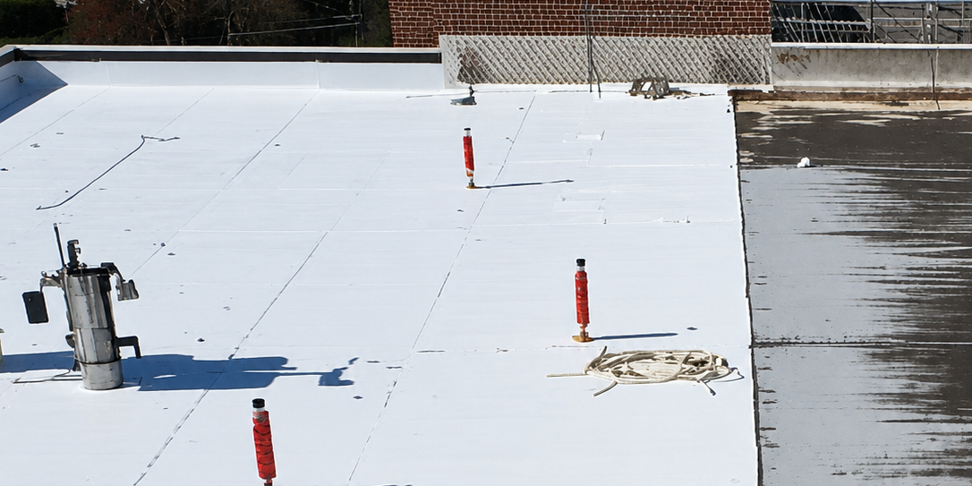 roof coating vs replacement on a commercial flat roof - Silicoat Roofing Michigan