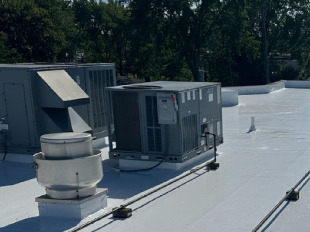 commercial roof coating contractor - silicone-coated flat roof with HVAC units, Silicoat Roofing
