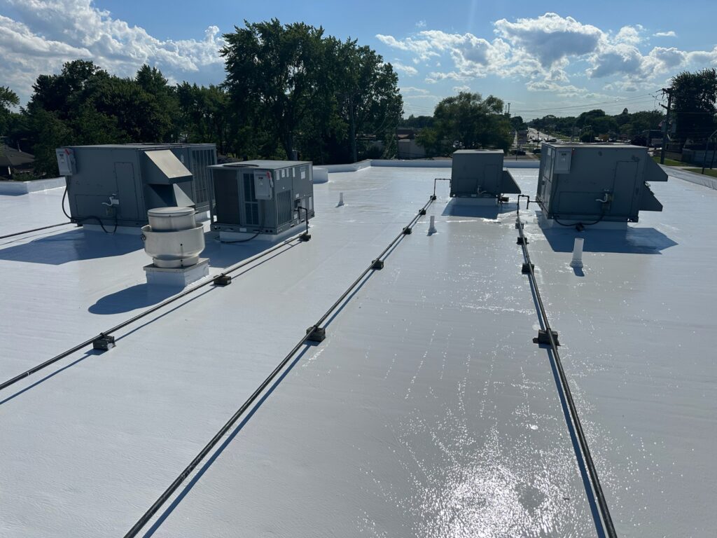 Reflective white roof coating on a Detroit commercial building